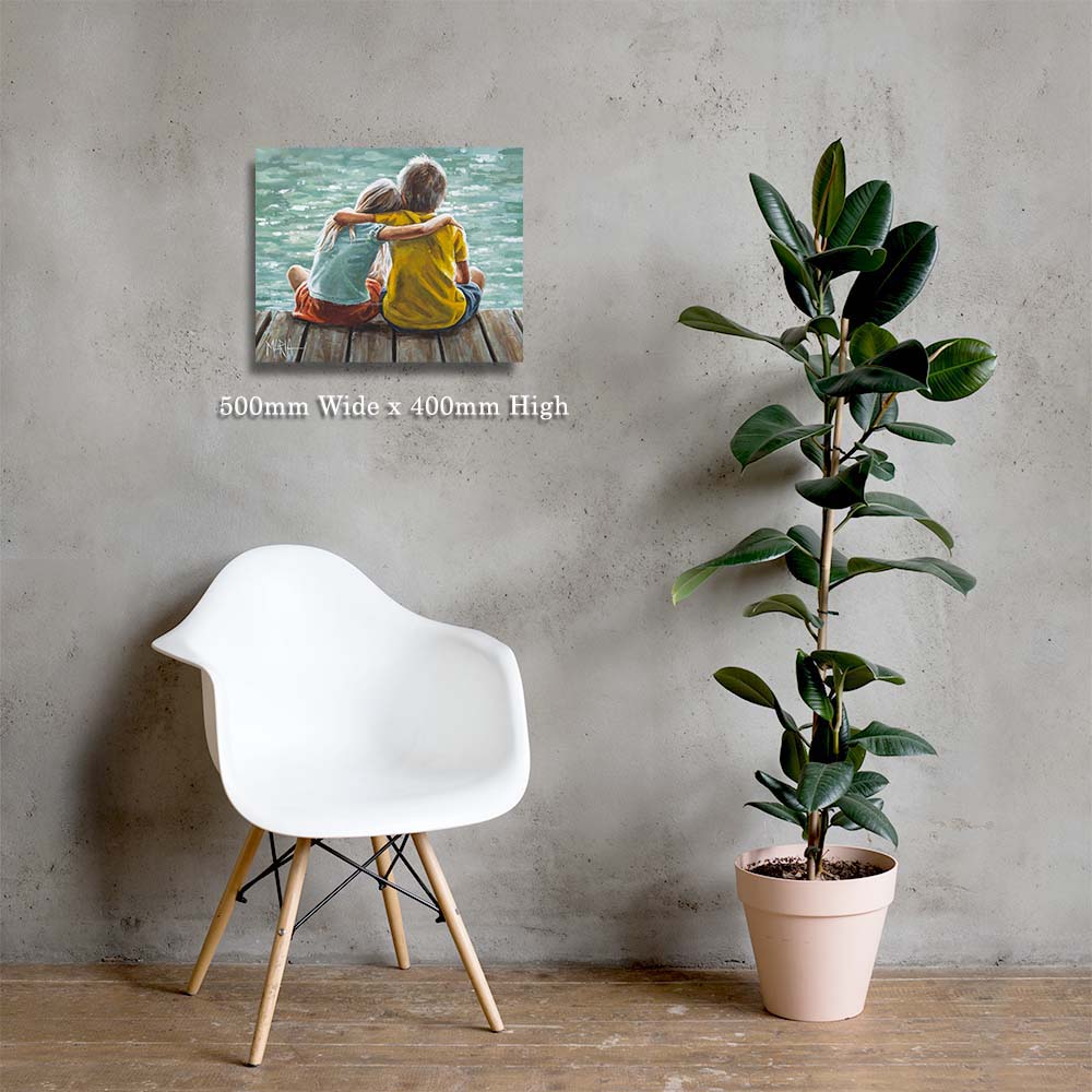 Wall art of two people sitting by a lake, white chair, and potted plant against a gray wall.