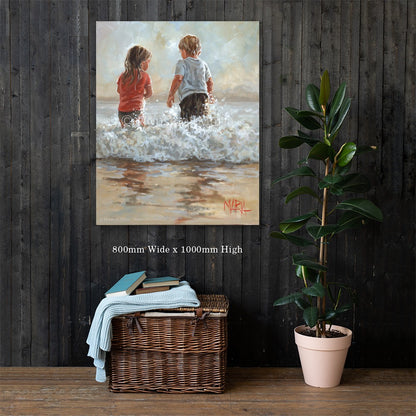 Into the Waves — two children running into the ocean waves by Maria Magdalena Oosthuizen, 800 x 1000mm canvas print on a dark wood wall | canvas print wall art | House of Maria