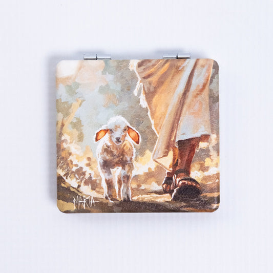 The Shepherd — pocket mirror with a lamb following the Shepherd's feet by Maria Magdalena Oosthuizen | Christian art pocket mirror | House of Maria