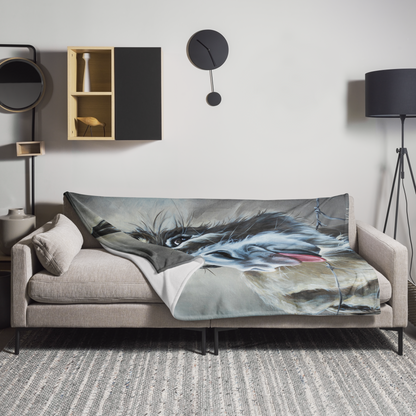Sofa with a decorative blanket featuring an artistic depiction of a horse's head in a modern living room.