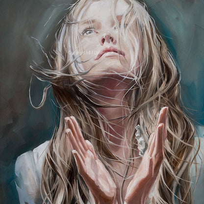 Fine art print of a woman's face with a spiritual or worshipful expression, with her hands lifted or closed in a praying gesture. The image has a white border and is centered on the paper.